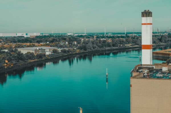 Looking out from the Überseeinsel over the Weser – river view with an industrial structure on the right edge of the image