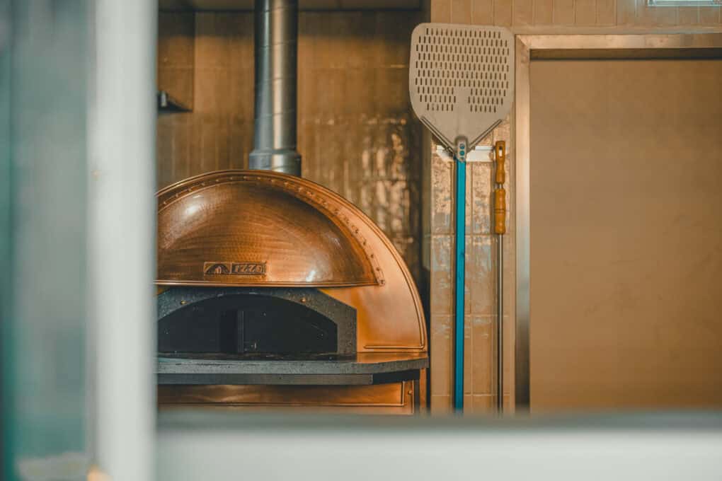 Original pizza oven in the Dachstuuv of the John & Will Hotel Bremen to prepare an fresh Neapolitan pizza served at events above the rooftops of the Überseeinsel.