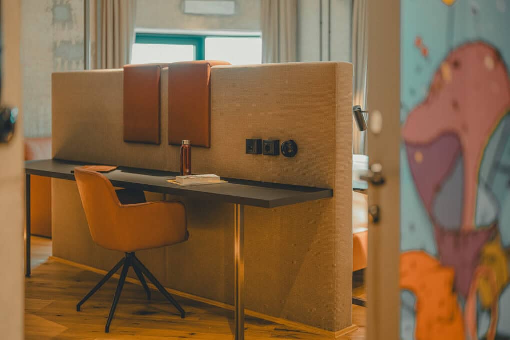 Spacious round room with desk and double bed, Best Stuuv at John & Will hotel Bremen in a converted grain silo
