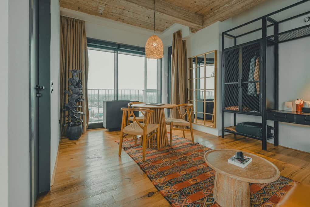 Torn Stuuv at the John & Will Hotel the private suite with bright seating area, cozy modern interior design and exclusive rooftop terrace access